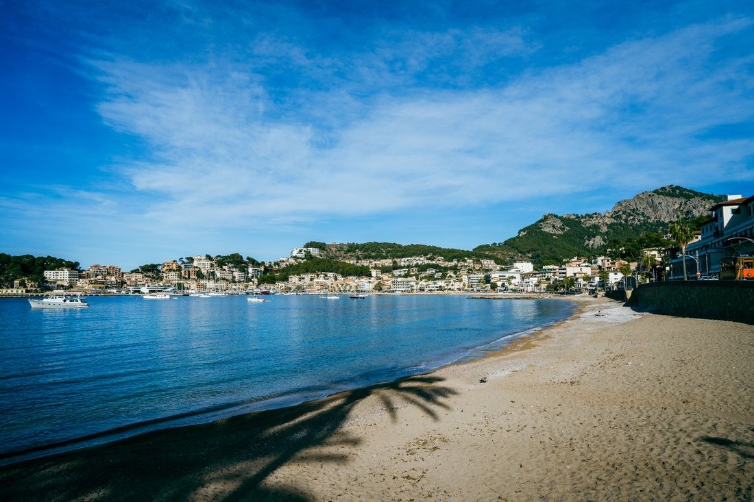 Coastal apartment buildings and homes overlooking the bay in Port de Sóller, Spain